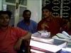 Siby, Aneesh and Chakku - in between mountains of books